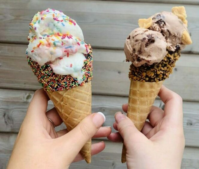 Hands holding ice cream cones