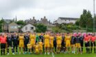 Forres Mechanics, Elgin City and the officials line up ahead of Graham and Lee Fraser's testimonial match on Friday.