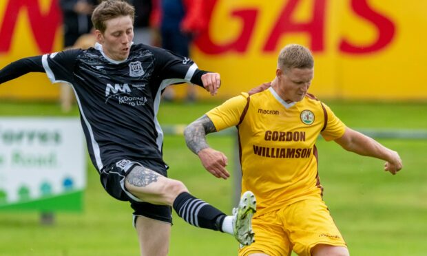 Forres Mechanics defender Graham Fraser, right, in action against Elgin City striker Kane Hester.