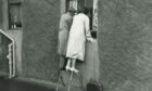 Rising to the occasion to see a typhoid patient who was under lock and key in June 1964.