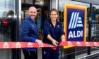 Store manager Andrew Murison and Team GB's Gemma Gibbons cutting the ribbon. Supplied by Aldi.