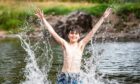 Fergus Leece, 11, enjoyed splashing around the River Dee. Picture by Wullie Marr.