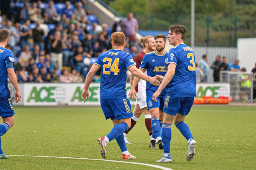 Fraser Fyvie is congratulated after scoring for Cove Rangers against Kelty Hearts