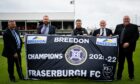 Fraserburgh manager Mark Cowie, centre, and committee members, with the league championship flag before the league opener against Deveronvale. Picture by Wullie Marr.