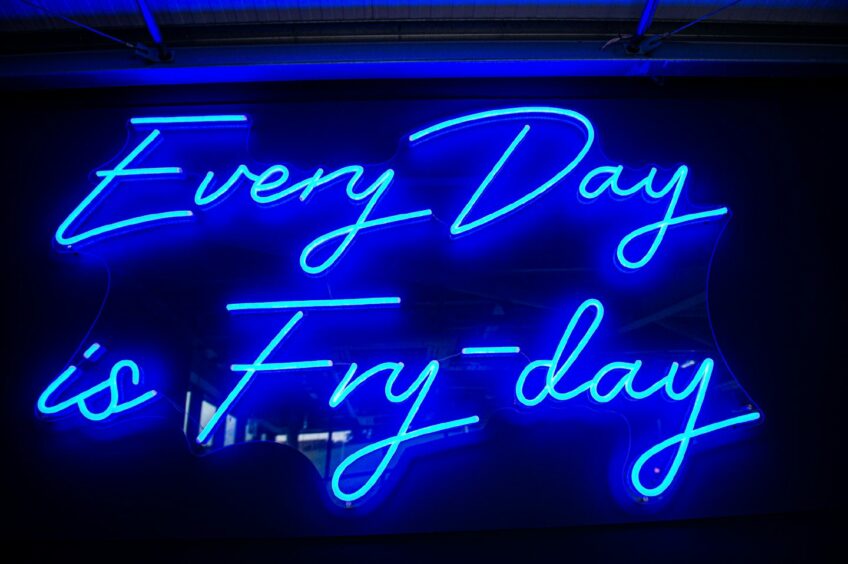 A blue neon sign that reads "Every Day is Fry-day"
