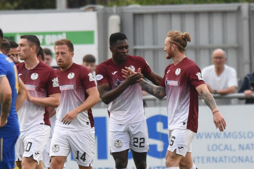 Kelty Hearts forward Alfredo Agyeman is congratulated by Robbie McNab after giving his side the lead against Cove Rangers.