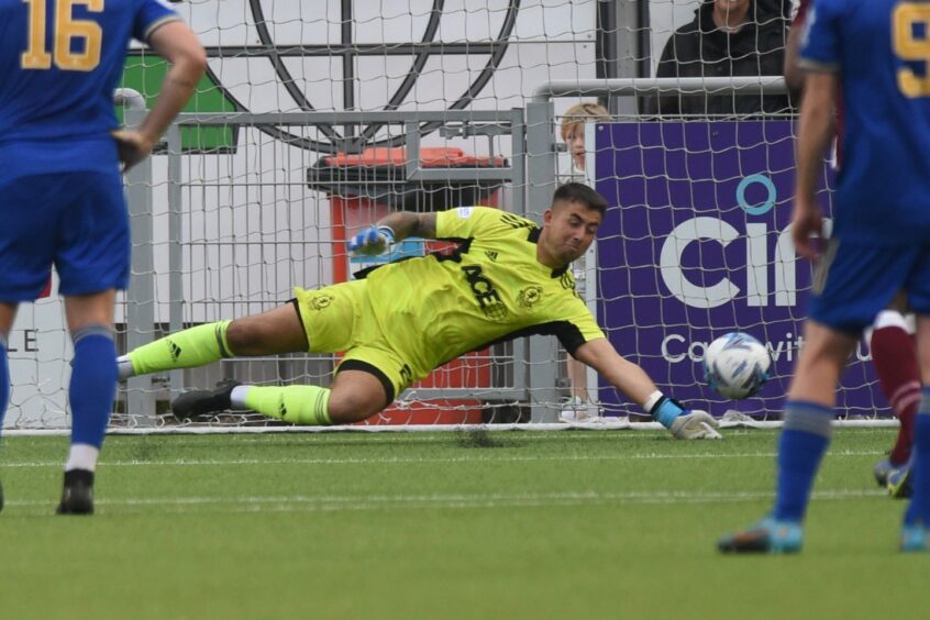 Cove Rangers goalkeeper Kyle Gourlay keeps out Nathan Austin's penalty against Kelty Hearts