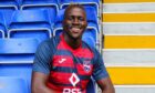 William Akio has become Ross County manager Malky Mackay's 10th signing of the summer
