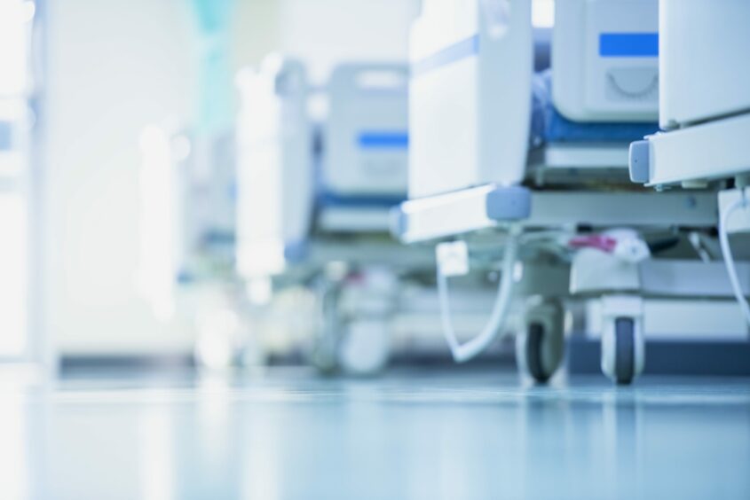 A row of beds in a hospital ward