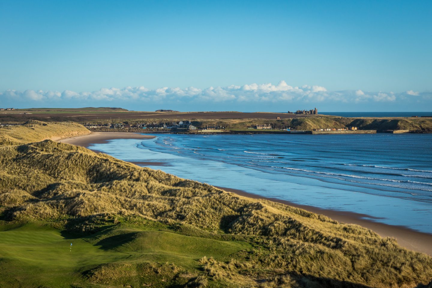 Cruden Bay with Slains Castle in the distance.