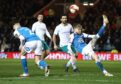 Coulson in action for Peterborough United against Manchester City