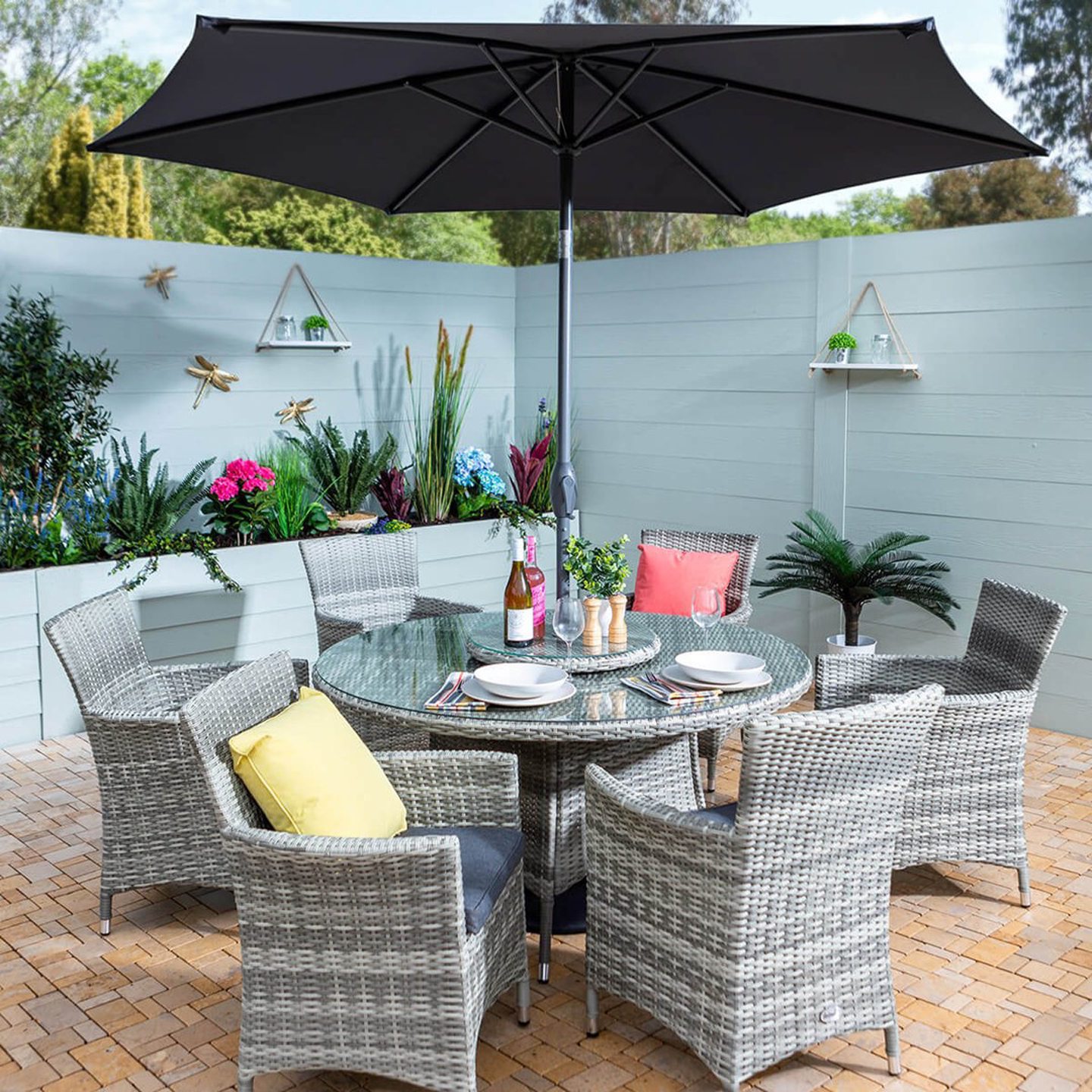 Outdoor dining table, chairs and parasol