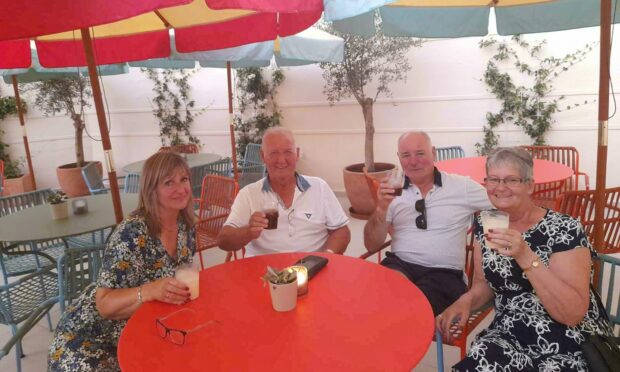 Helen Mackay, Robin Young, Alister Mackay and Rona Young enjoying their holiday before the airport delays. Submitted/Grant News Agency