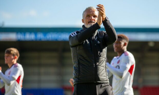 Aberdeen manager Jim Goodwin applauds the fans following the 1-0 win at St Johnstone.