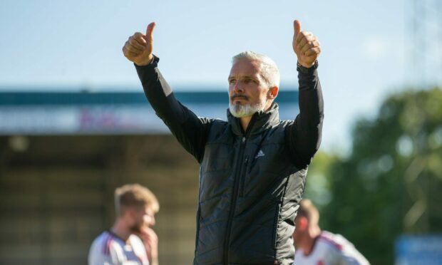 Aberdeen manager Jim Goodwin gives fans the thumbs up after the defeat of St Johnstone.