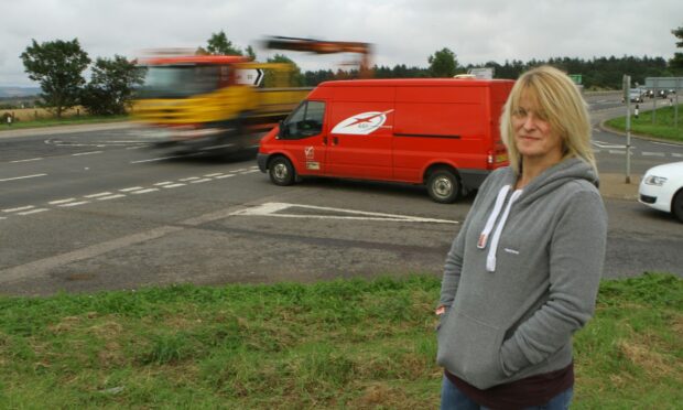 Jill Fotheringham at the A90 junction, which is often busy with heavy traffic and HGVs. Image: Dougie Nicolson.