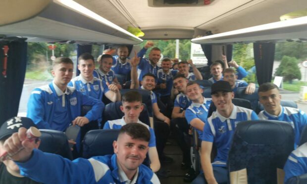 Benburb players celebrate on board their bus after knocking Fort William out of the Scottish Cup. Photograph - Courtesy of Benburb Juniors