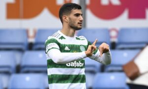 Celtic's Liel Abada celebrates his goal in the 3-1 win at Ross County on Saturday, with a glimpse of the empty seats in the home section behind him.