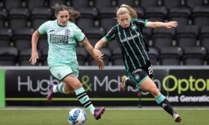 Celtic's Lucy Ashworth-Clifford, right, and Hibs' Poppy Lawson, left, in action on the opening day of the SWPL 1 season. (Photo by Craig Williamson / SNS Group)