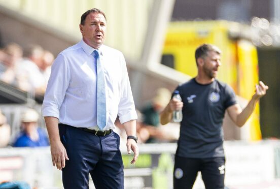 Ross County manager Malky Mackay, front, with St Mirren boss Stephen Robinson in the background.
