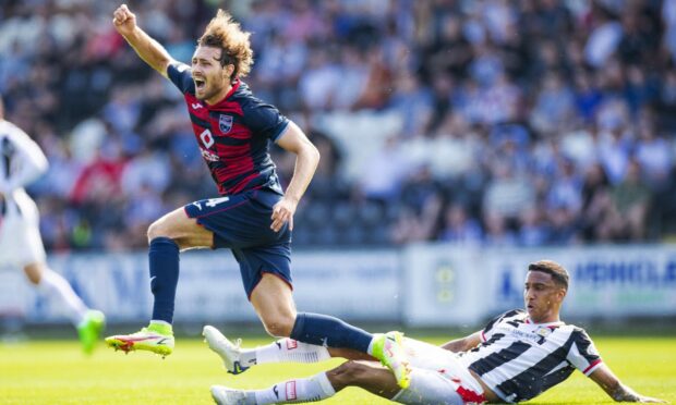 Ross County midfielder David Cancola is challenged by St Mirren's Keanu Baccus.