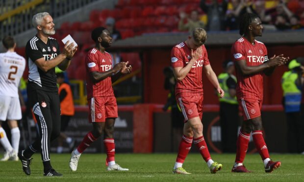 Aberdeen players look dejected at full time after losing 3-2 to Motherwell at Pittodrie.