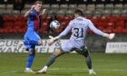 Partick Thistle goalkeeper David Mitchell saves a shot from Inverness striker Billy McKay.