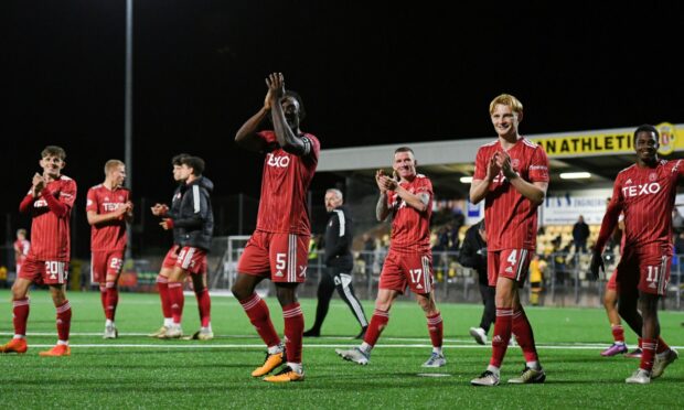 Aberdeen players applaud the fans after extra-time at Annan.