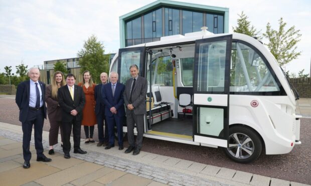 Officials turn out to mark the beginning of trials for the city's first self-driving bus.