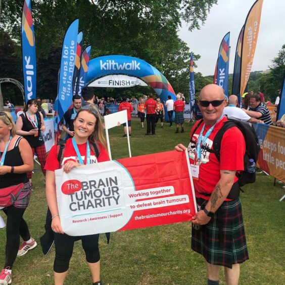 Katy and her dad after completing the 26-mile Aberdeen Kiltwalk.