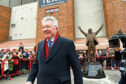Sir Alex Ferguson in front of a new statue at Pittodrie. Photo: Craig Foy/SNS Group.