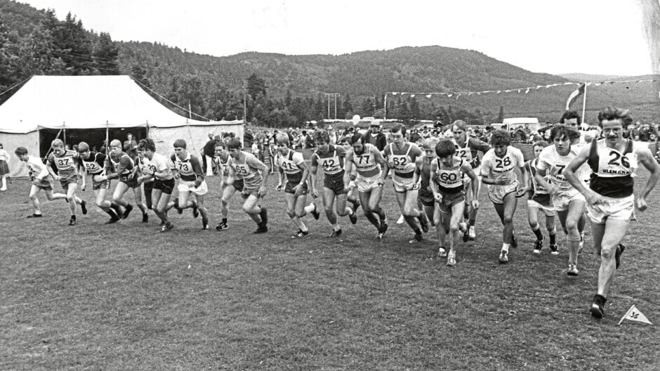 People running in the hill race at the Ballater Highland Games