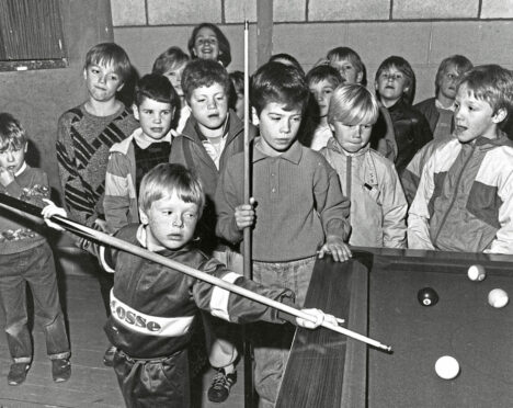 1986 - Derek Miller, 6, takes a shot in the final of the under-12s Tillydrone Community Centre pool competition