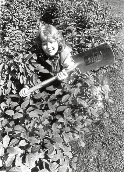 1988 - Jacqueline Dailly helps plant bushes and plants outside the Tillydrone Community Centre