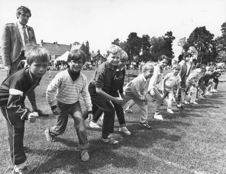 1987- On your marks...youngsters get ready for the under-14 100yd race.