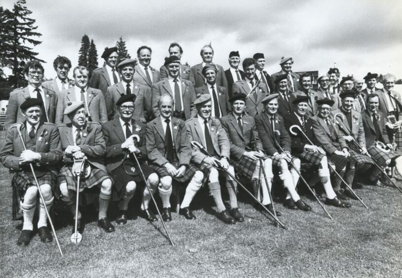 1987- Officials and members of the committee at the Aboyne Highland Games pictured together for the official photograph. Seated in the middle is the Chief of the event the Marquess of Huntly.