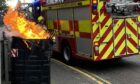 A communal bin caught fire on Belmont Road. Picture by Alastair Gammack.