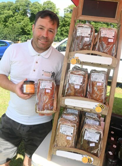 Brian Gall holding some of his products