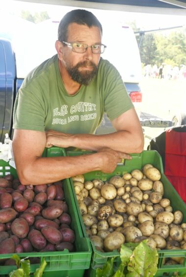Mark Barsby with two boxes of potatoes