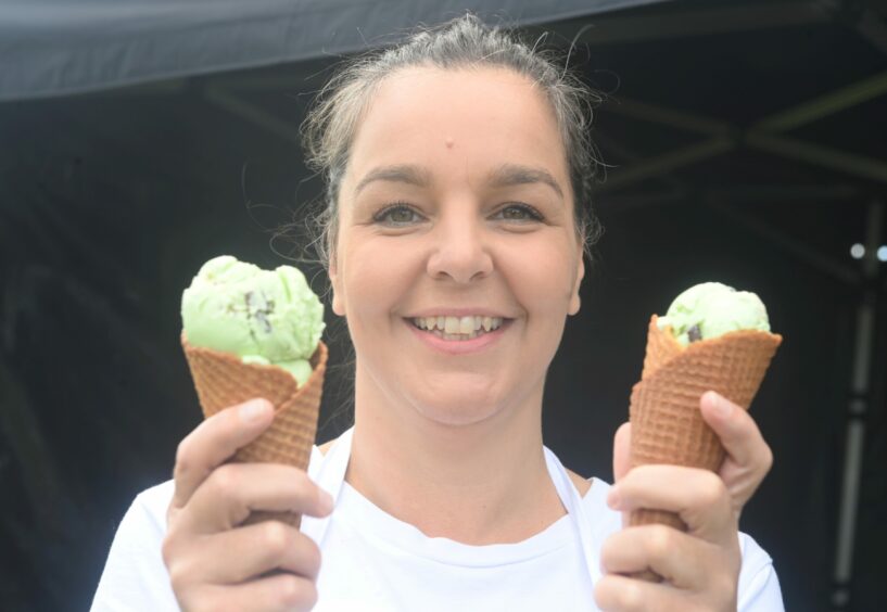 Lisa Milne holding two ice-cream cones