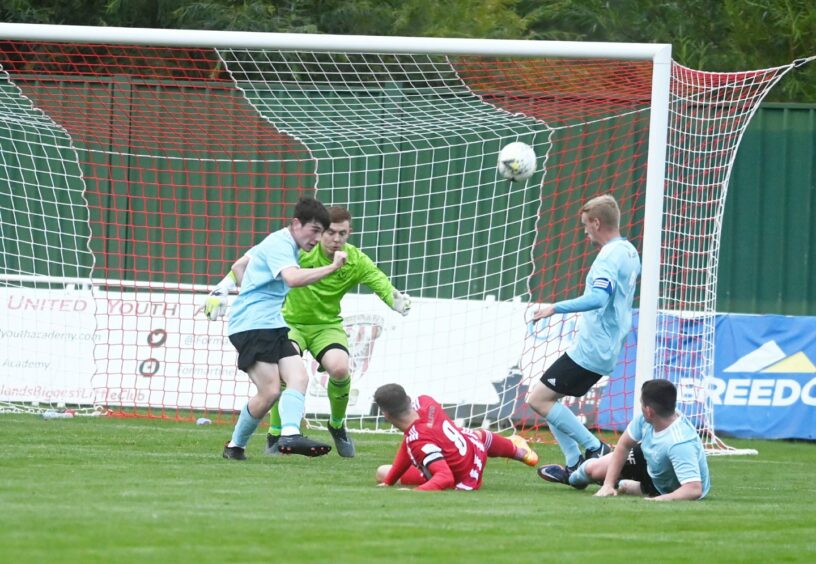 Formartine striker Jonny Smith turns an early chance over the bar