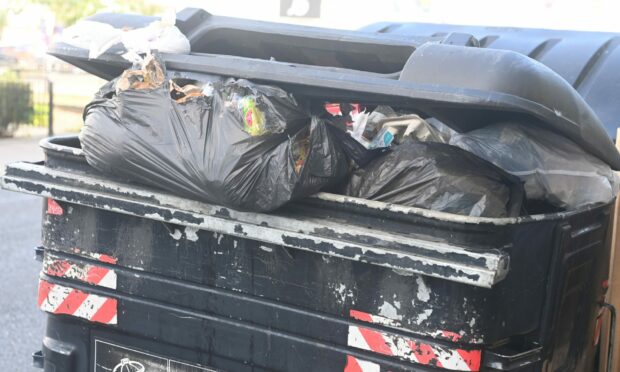 An overflowing bin on Bedford Road in Aberdeen on Friday. Photo: Chris Sumner/DC Thomson