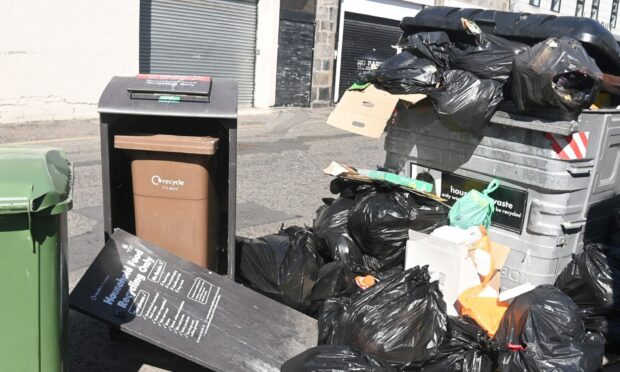 Overflowing bins at Langstane Place in Aberdeen. Picture: Chris Sumner/DC Thomson.