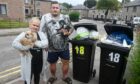Wendy Steven and Mark Haile with their Chihuahuas, next to the overflowing bins. Picture by Chris Sumner / DC Thomson.