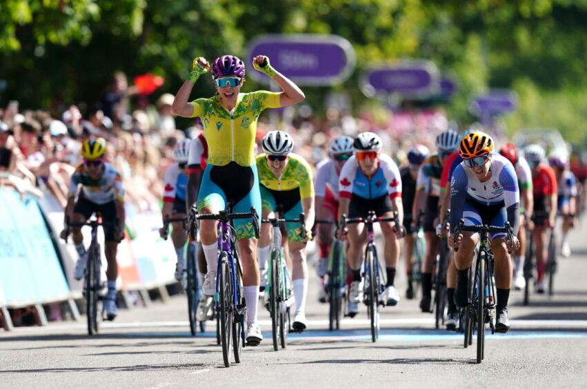 Australia's Georgia Baker celebrates winning gold as Scotland's Neah Evans (right) takes silver during the Women's Road Race in Warwick. Photo by David Davies/PA Wire