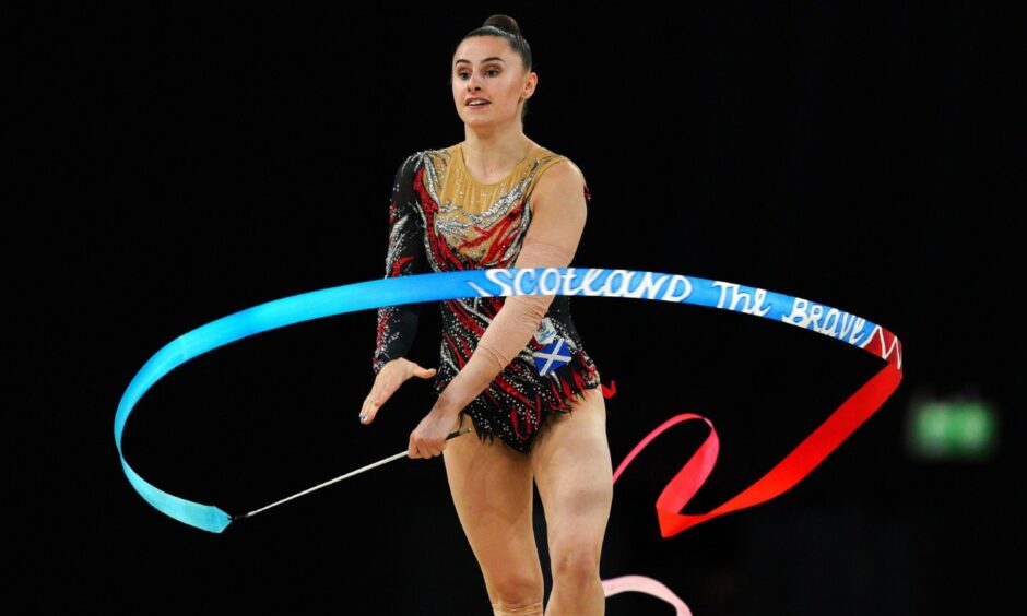 Scotland and Aberdeen gymnast Louise Christie with her 'Scotland the Brave' ribbon in the individual all-around final. Photo by Peter Byrne/PA Wire