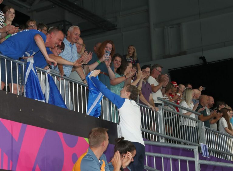 Scotland's Toni Shaw celebrates with her family after winning bronze in the Women's 100m Freestyle S9 - Final at Sandwell Aquatics Centre. Photo by Bradley Collyer/PA Wire