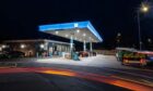 Nightime picture of Co-Op petrol forecourt.