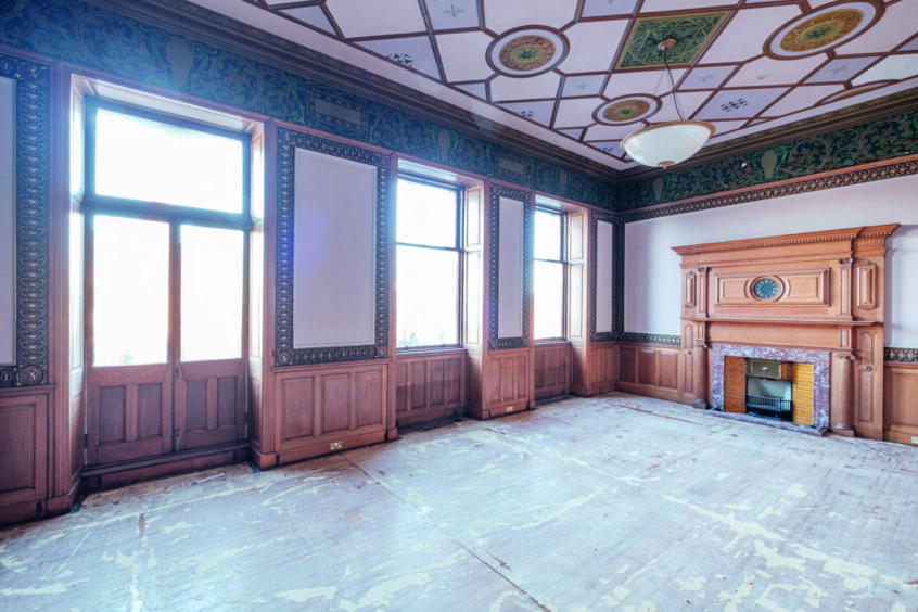 Inside the old bank: Who knows what this room will become but it would be a shame to lose the grand wooden fireplace.