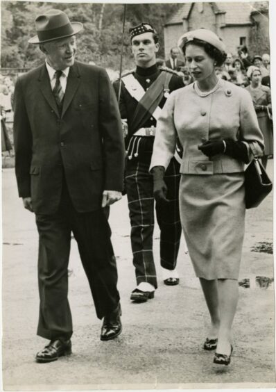 The Queen walking with Dwight Eisenhower